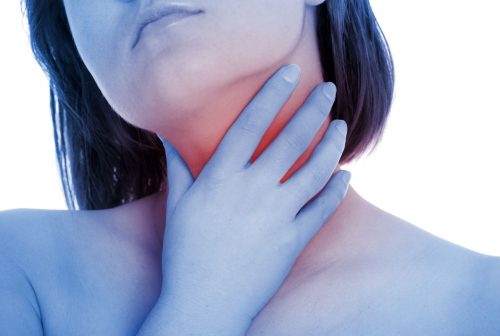 13416642 - a picture of a young woman suffering from tonsillities over white background